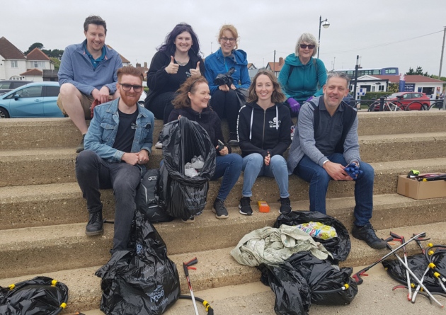 The vegan network posing on some steps together