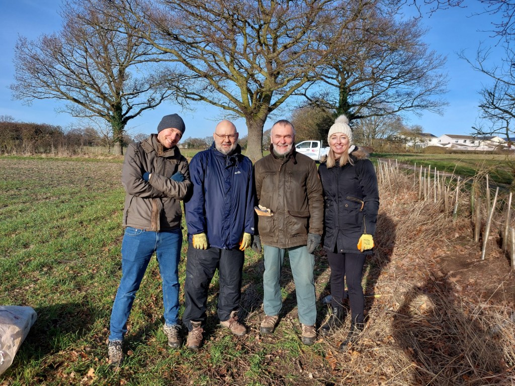 Network Co-Chairs lined up in a sunny field